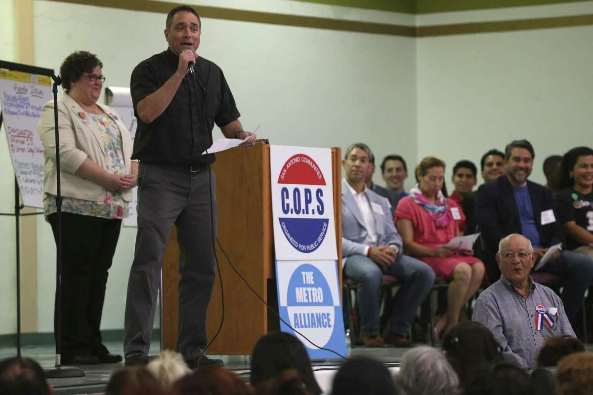 The Rev. Brian Christopher of Guadalupe Catholic Church fires up the crowd during the Communities Organized for Public Service/Metro Alliance 2017 Accountability Session at St. Henry's Catholic Church April 24, 2017. San Antonio mayoral and City Council candidates were invited to the event to address questions about housing, immigration and economic security. About 750 members attended the event.