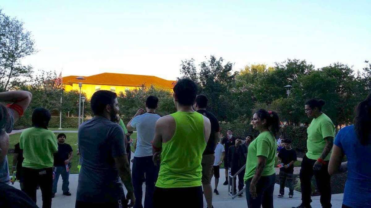 Players and zombies (in green shirts) prepare for the next round