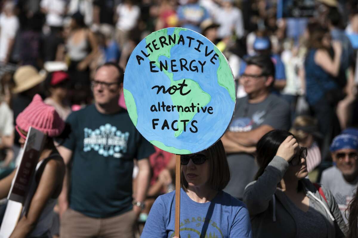 People take part in the March for Science in Los Angeles, California on April 22, 2017. The event which coincides with Earth Day was held in protest of President Donald Trump's environmental policies and his budget proposals to cut funding for scientific research. (Photo by Ronen Tivony/NurPhoto via Getty Images)