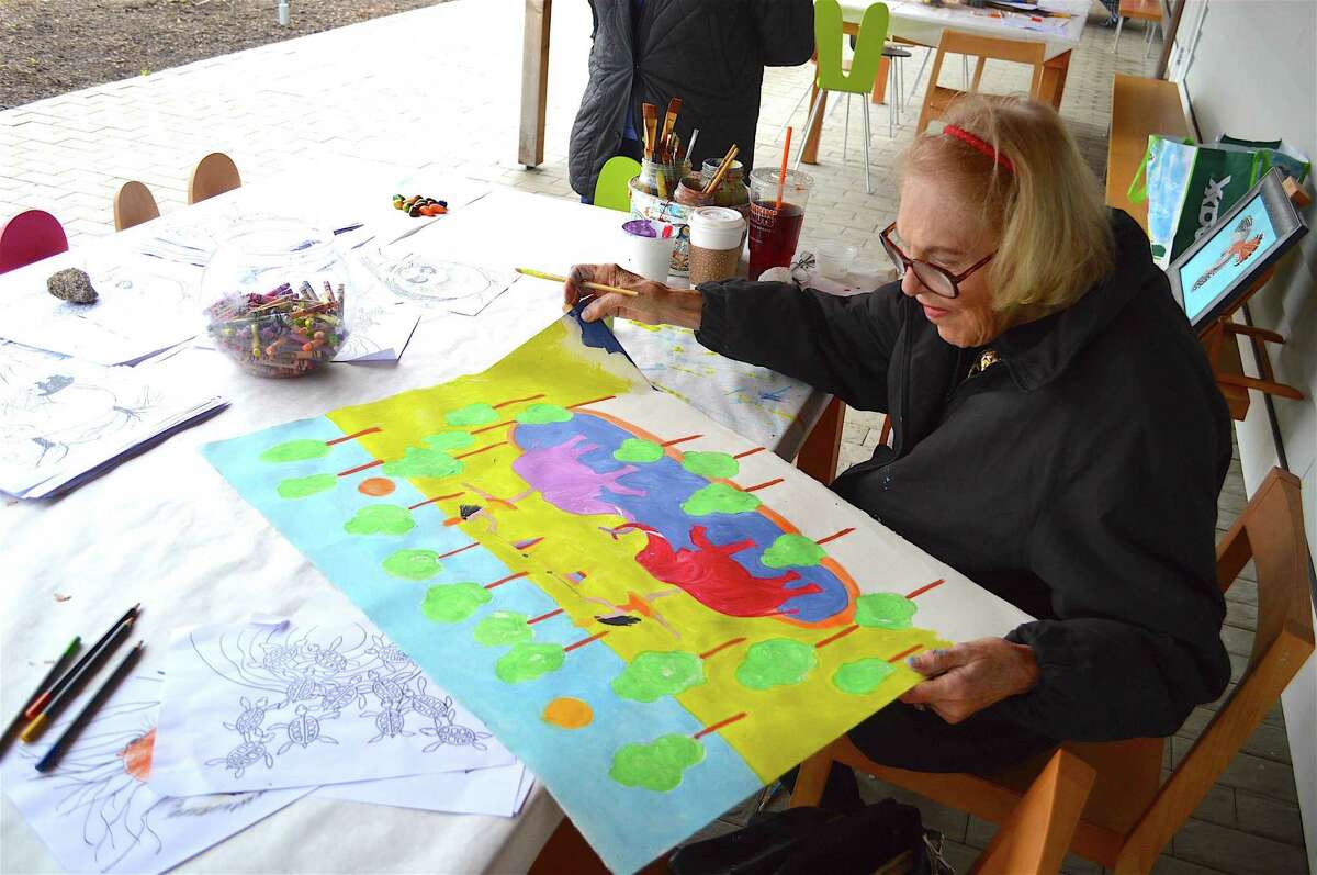 Betsy Fowler of Rowayton enjoys doing some artwork at the Earth Day celebration at Grace Farms, Saturday, April 22, 2017, in New Canaan, Conn.