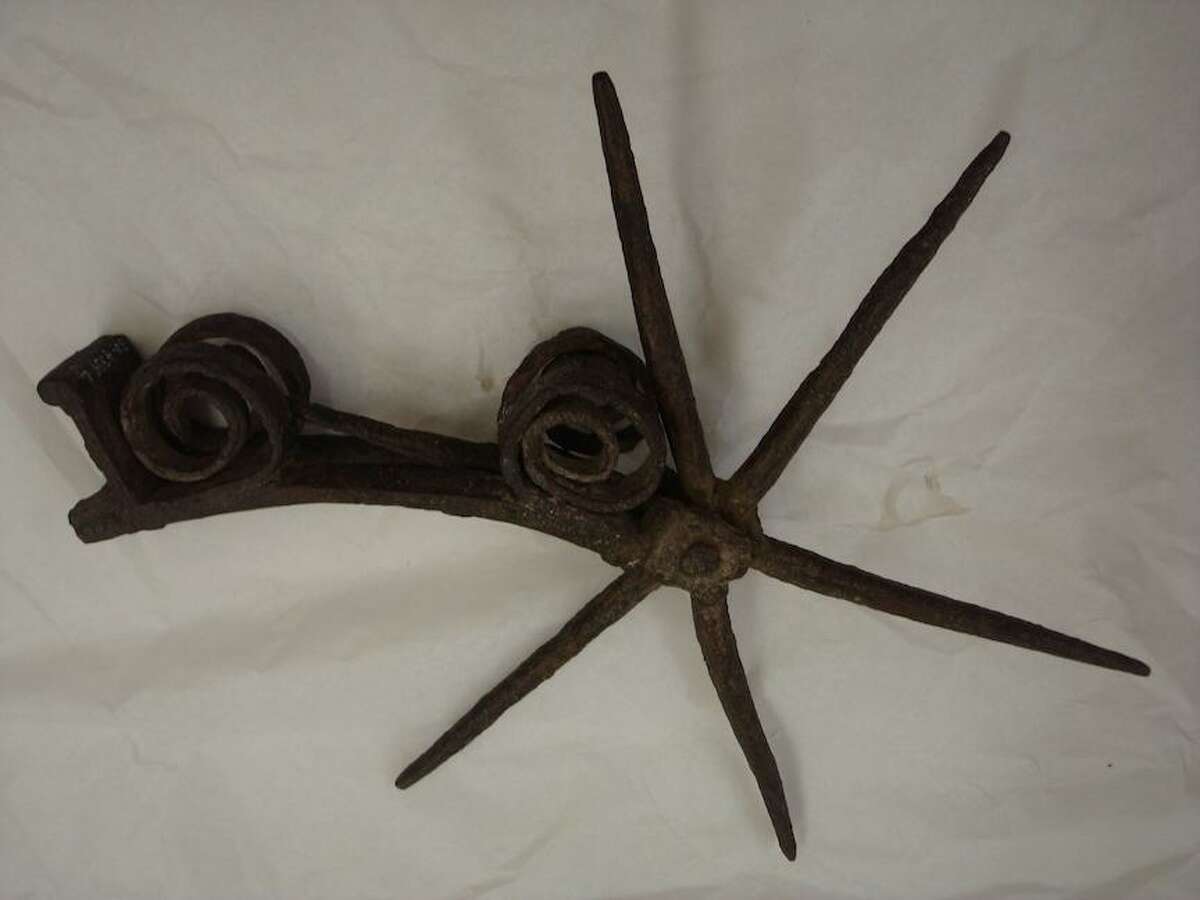 This "relic" spur was found at Espantosa Lake, a campsite along El Camino Real, in the 1930s. The spur is Spanish and likely dates to the 16th or 17th century. The diameter of the rowel spans about 10 inches.