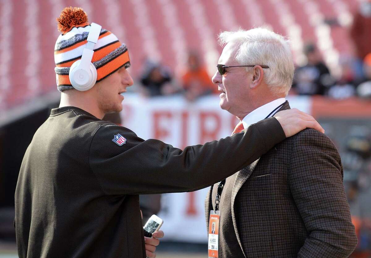 Johnny Manziel #2 of the Cleveland Browns talks with owner Jimmy Haslam prior to the game against the Indianapolis Colts at FirstEnergy Stadium on December 7, 2014 in Cleveland, Ohio.