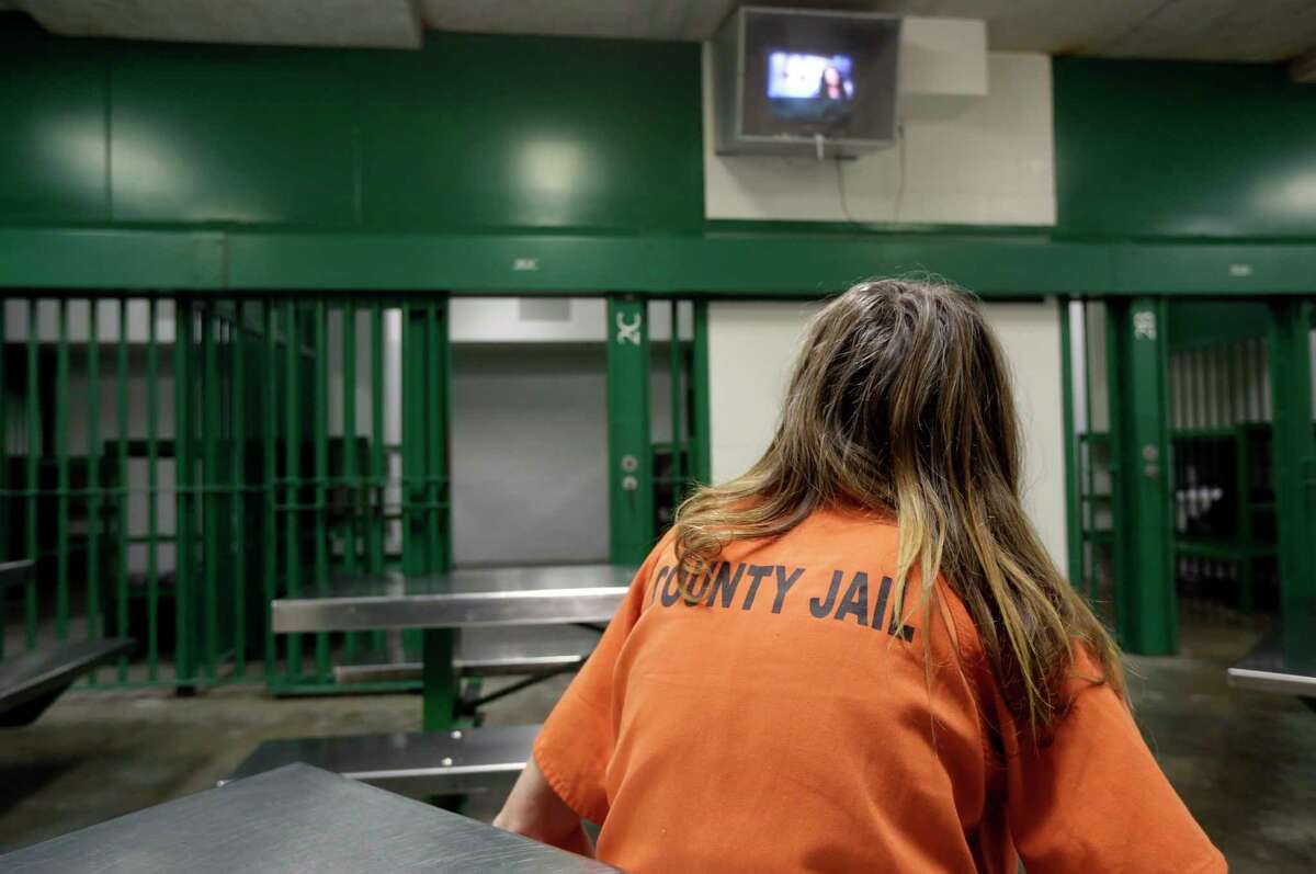 A female inmate sits in a single cell in an acute unit of the mental heath unit at the Harris County Jail in Houston. (AP Photo/Eric Gay)