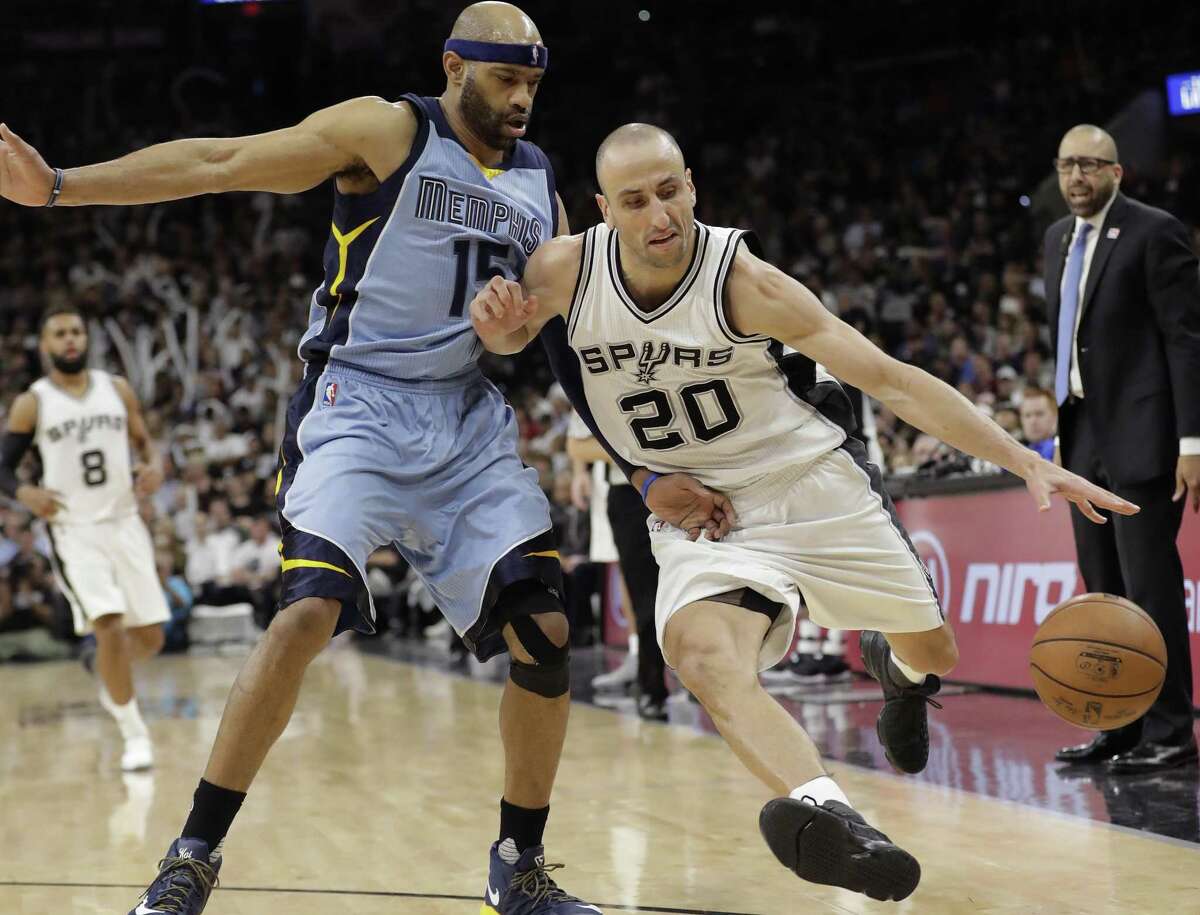 Spurs guard Manu Ginobili (20) drives around Memphis Grizzlies guard Vince Carter (15) during the second half in Game 2 of a first-round playoff series on April 17, 2017, in San Antonio.