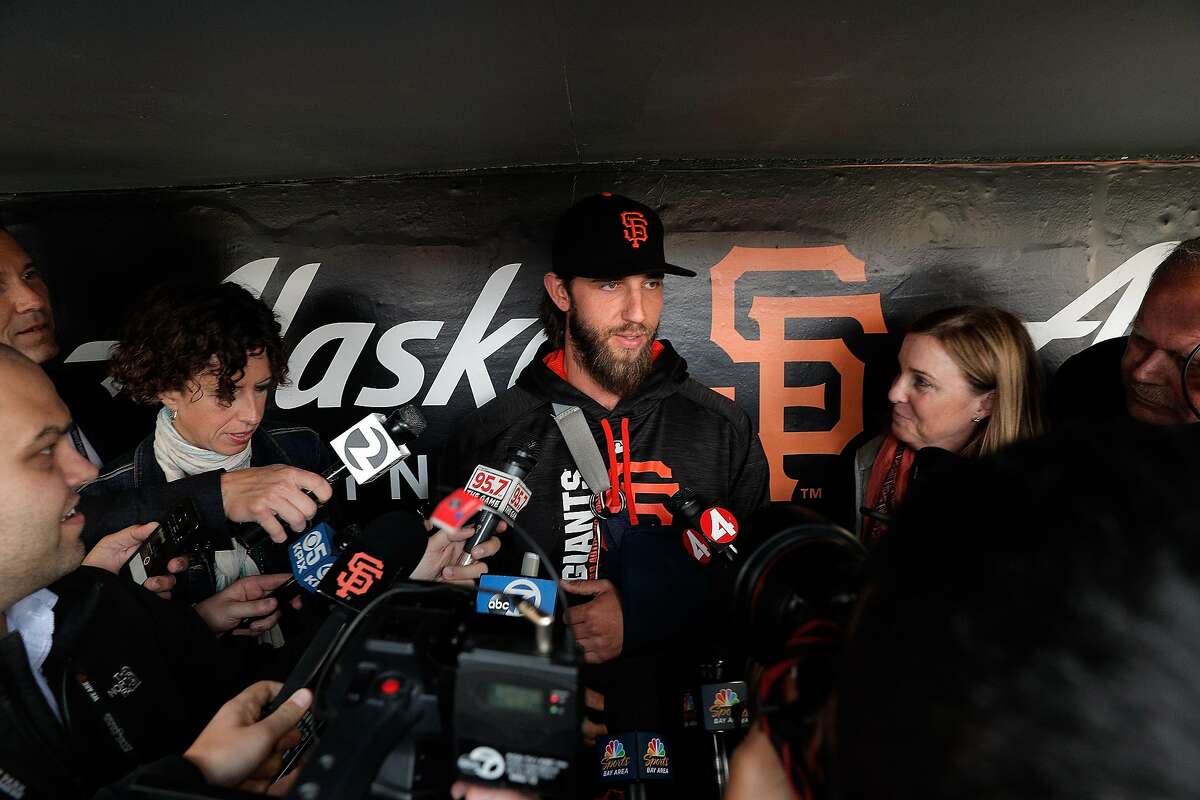 Madison Bumgarner (40) answers questions from the press during batting practice before the San Francisco Giants played the Los Angeles Dodgers at AT&T Park in San Francisco, Calif., on Monday, April 24, 2017.