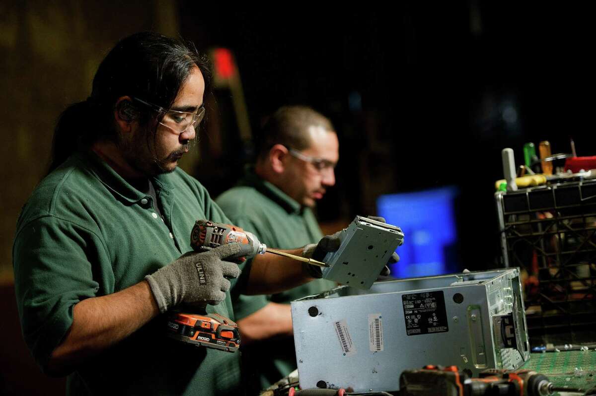 Employees at a Green Citizen recycling facility in Burlingame, California, take apart used electronics to remove valuable materials from inside them. Austin-based Urban Mining Company wants to invest $25 million into San Marcos to build a 100,000-square-foot recycling and manufacturing facility for rare earth metal magnets.