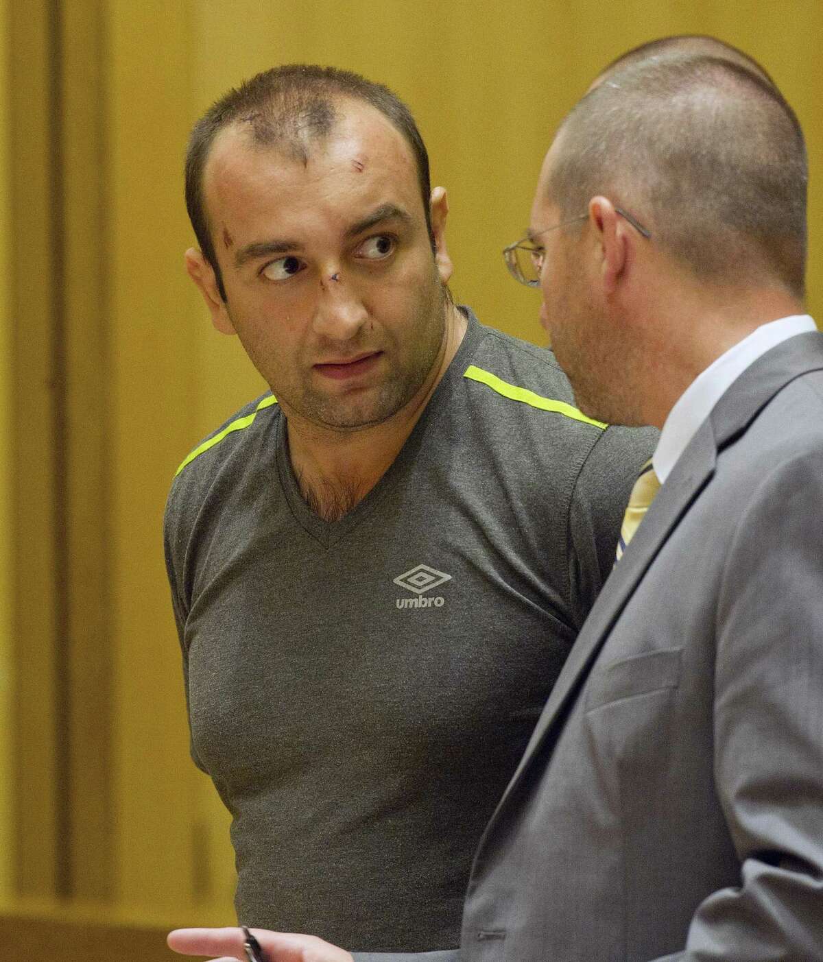 Shota Mekoshvili, with his former attorney Lindy Urso in State Superior Court in Stamford, Conn., on Friday, August 29, 2014. Mekoshvili is accused of murdering Mohammed Kamal, the Stamford Taxi driver found stabbed to death near his cab on Doolittle Road.