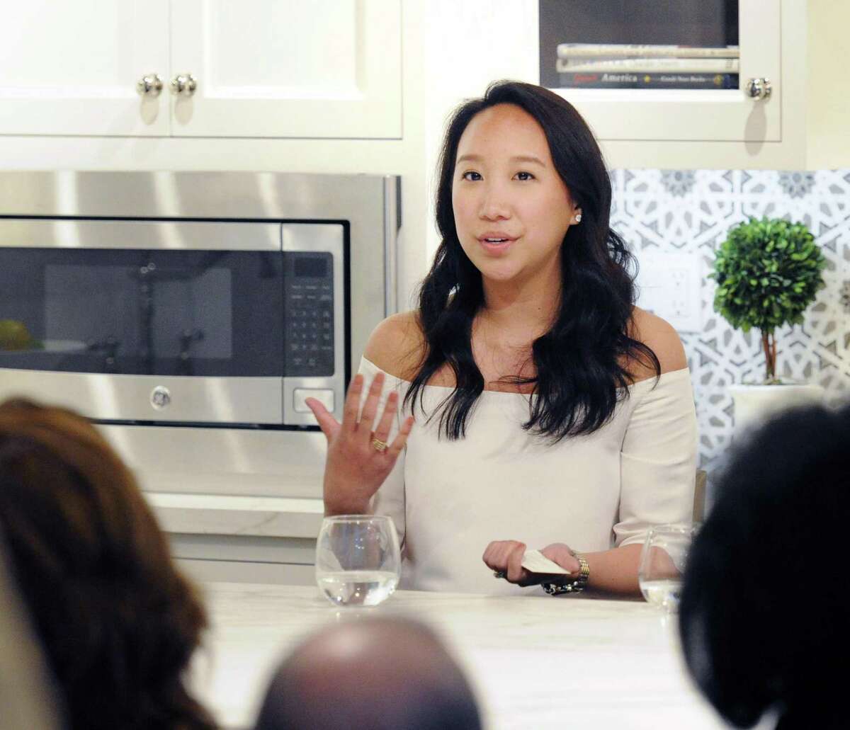 Greenwich resident Katie Fong, a fashion designer and the owner of the Katie Fong Boutique in Greenwich, speaks during a Luxury Marketing Council panel event on millennial consumers at Curry & Kingston Cabinetry in the Cos Cob section of Greenwich, Conn., Wednesday night, April 19, 2017.