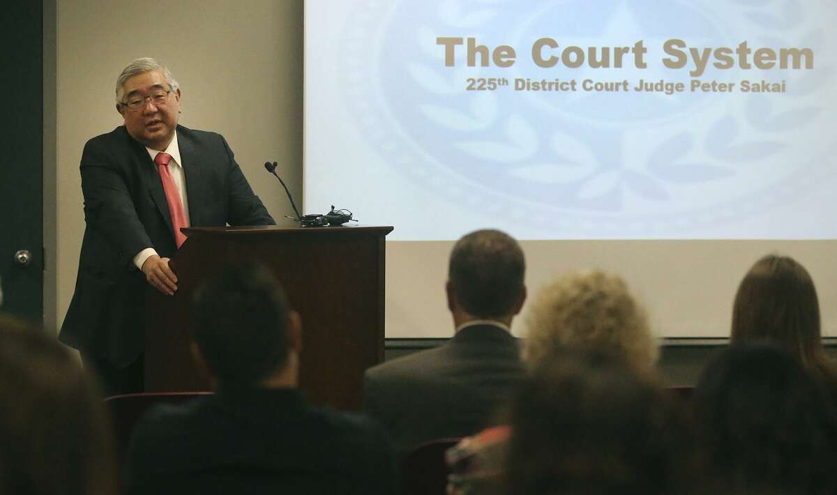State District Court Judge Peter Sakai (left) oversees the Early Intervention Court — the so-called “baby court,” for parents whose kids are younger than 3.