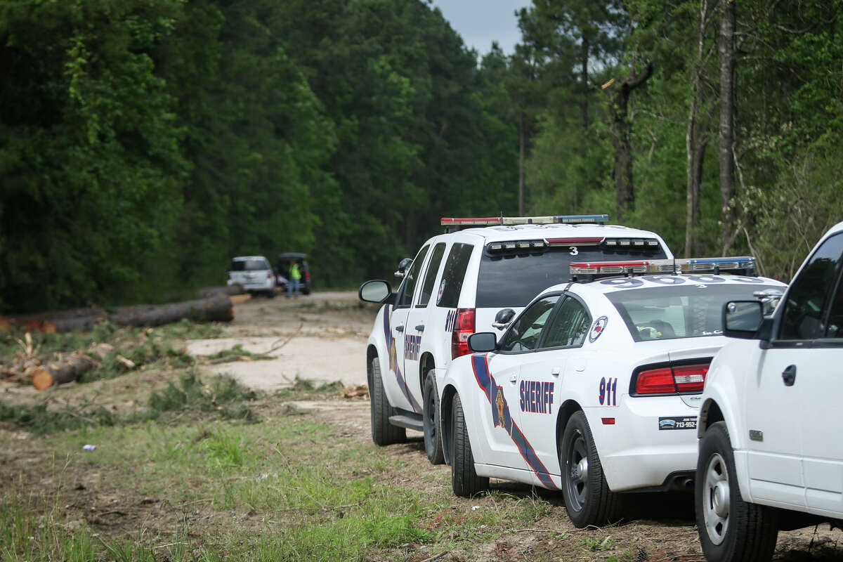 Montgomery County Sheriff's Office deputies investigate a scene where a deceased individual was found on Tuesday, April 25, 2017, along the railroad tracks near Comer Reinhart Road and the TX-494 Loop in New Caney.