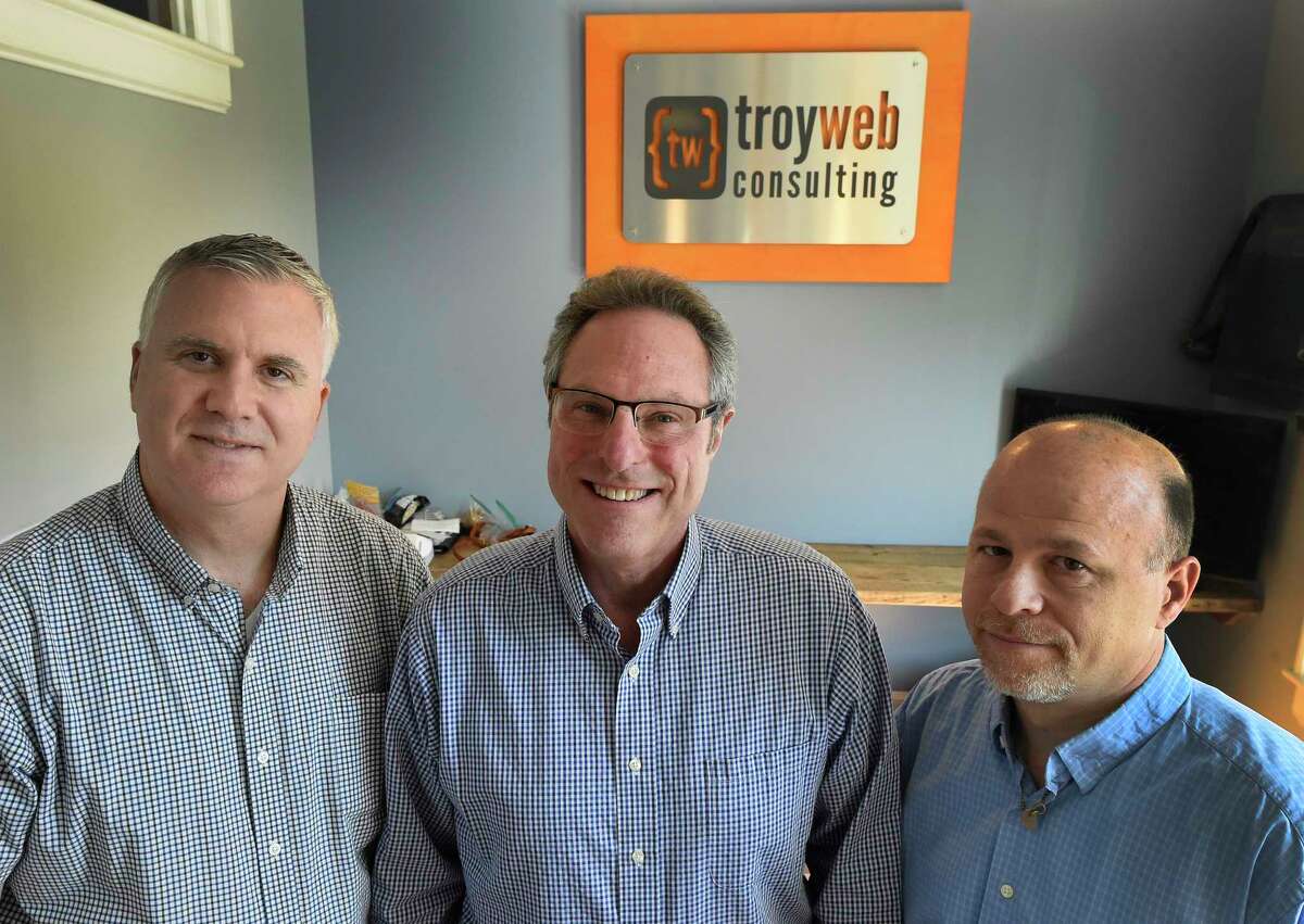 Top members of the company; Anthony Debonis, Director of Applications and Development, left; Mark Poskanzer, Director of Business Development, center; Jon Briccetti, President and CEO in the offices of Troy Web Consulting Tuesday April 18, 2017 in Troy, N.Y. (Skip Dickstein/Times Union)