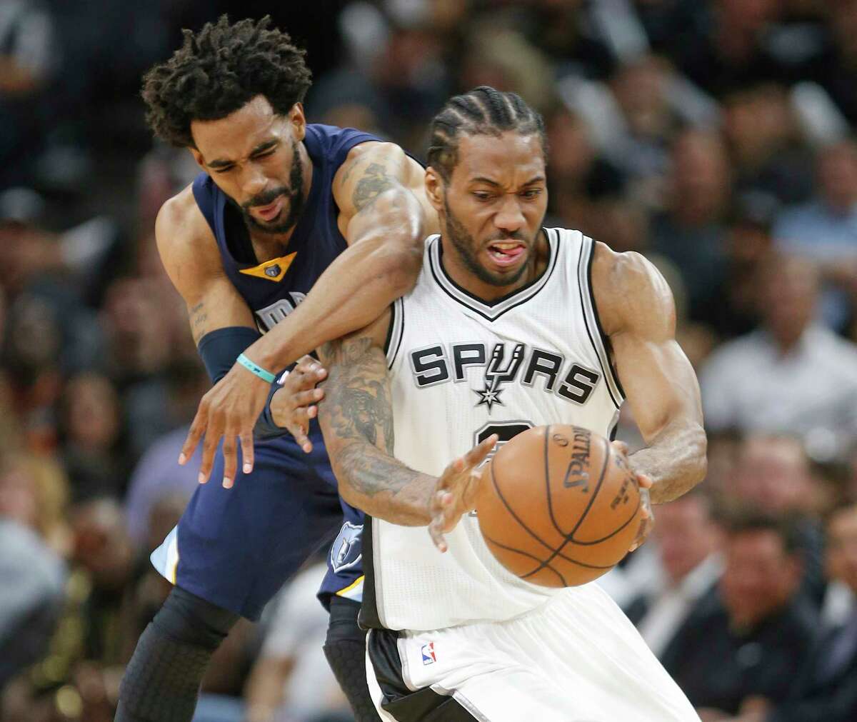 SAN ANTONIO,TX - APRIL 25 : After a steal by Kawhi Leonard #2 of the San Antonio Spurs Mike Conley #11 of the Memphis Grizzlies commits a clear path foul in Game Five of the Western Conference Quarterfinals during the 2017 NBA Playoffs at AT&T Center on April 25, 2017 in San Antonio, Texas. NOTE TO USER: User expressly acknowledges and agrees that , by downloading and or using this photograph, User is consenting to the terms and conditions of the Getty Images License Agreement.