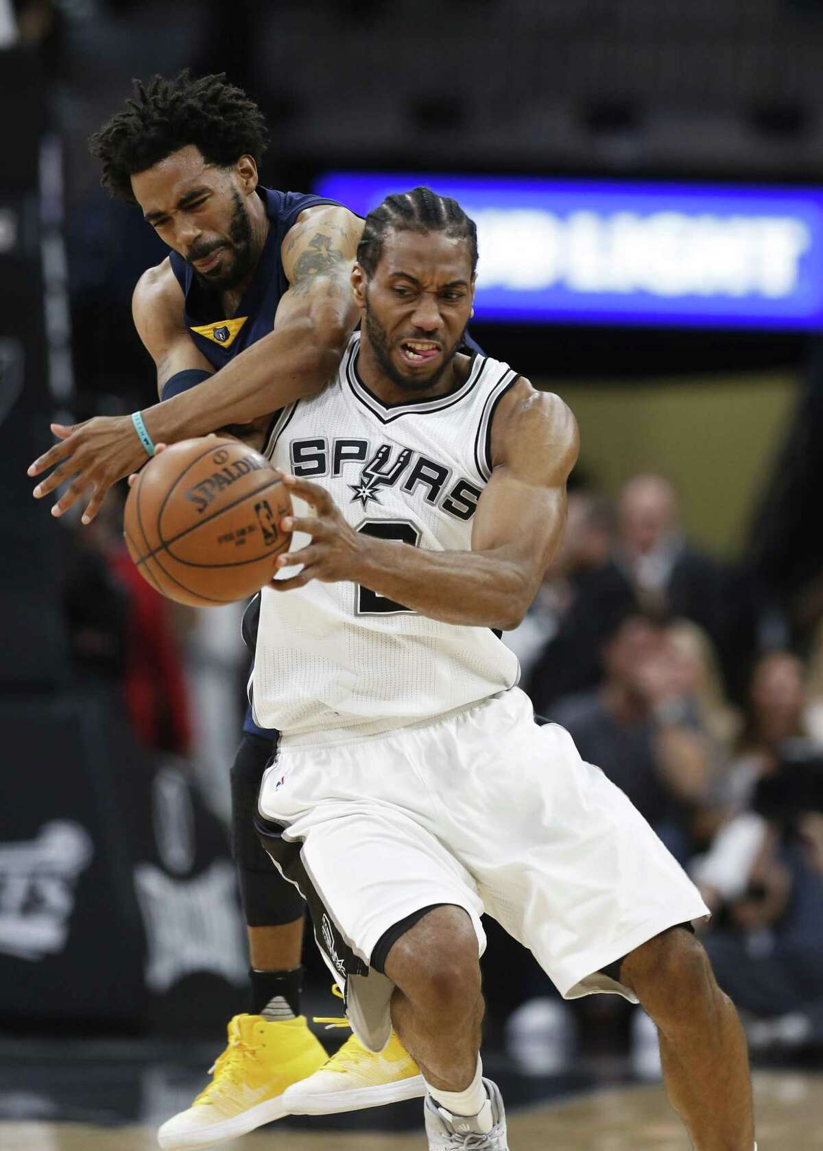 Spurs’ Kawhi Leonard steals an inbound pass against the Memphis Grizzlies’ Mike Conley during Game 5 of the Western Conference playoffs at the AT&T Center on April 25, 2017.