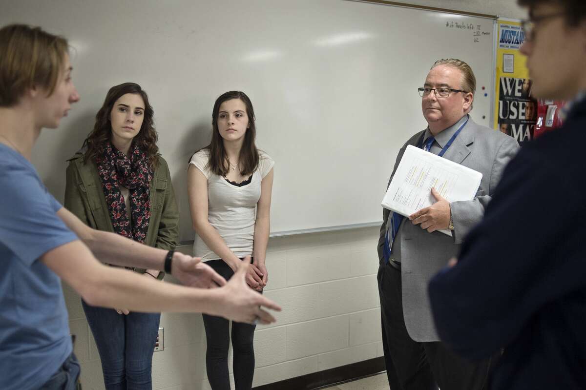 Meridian Early College High School students from left: junior Carson Yahrmarkt, sophomore Mya Hall, sophomore Kiernan Doud and senior Andrew Eyer talk with State Superintendent Brian Whiston about their experience in school.