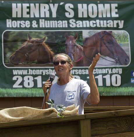Donna Stedman, founder Henry's Home Horse and Human Sanctuary, speaks before a ribbon cutting ceremony at Grand Central Park off Interstate 45, Wednesday, April 19, 2017, in Conroe. Members of Leadership Montgomery County provided a trailer and built an arena in addition to giving 5,000 in cash donations to the non-profit.