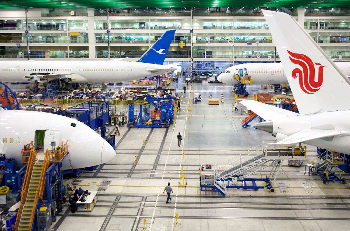 Boeing Dreamliner 787 planes sit on the production line at the company’s final assembly facility in North Charleston, South Carolina. Boeing’s revenue dropped 7.3 percent to $21 billion in the first quarter. Weak sales overshadowed a surprise gain in free cash flow as the manufacturer kept costs in check and started to reap a long-awaited payoff from the 787 Dreamliner.