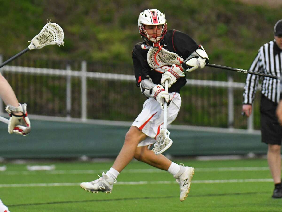 New Canaan’s Jackson Appelt fires a shot during the Rams’ 12-10 victory over Fairfield Prep on Saturday in Fairfield.