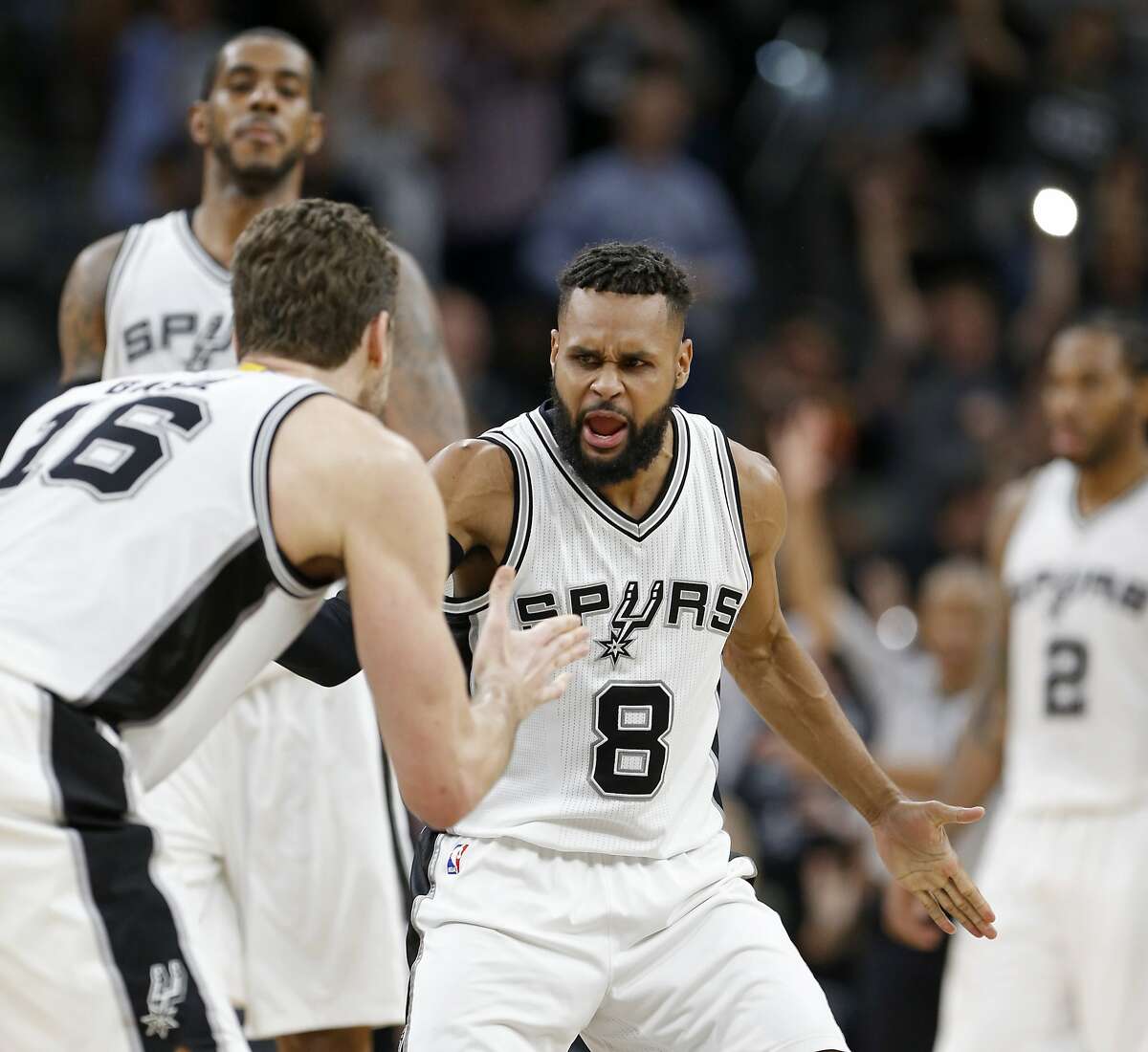 San Antonio Spurs' Patty Mills celebrates with Pau Gasol after Gasol made a 3-pointer during second half action of Game 2 in the first round of the Western Conference playoffs against the Memphis Grizzlies held Monday April 17, 2017 at the AT&T Center.