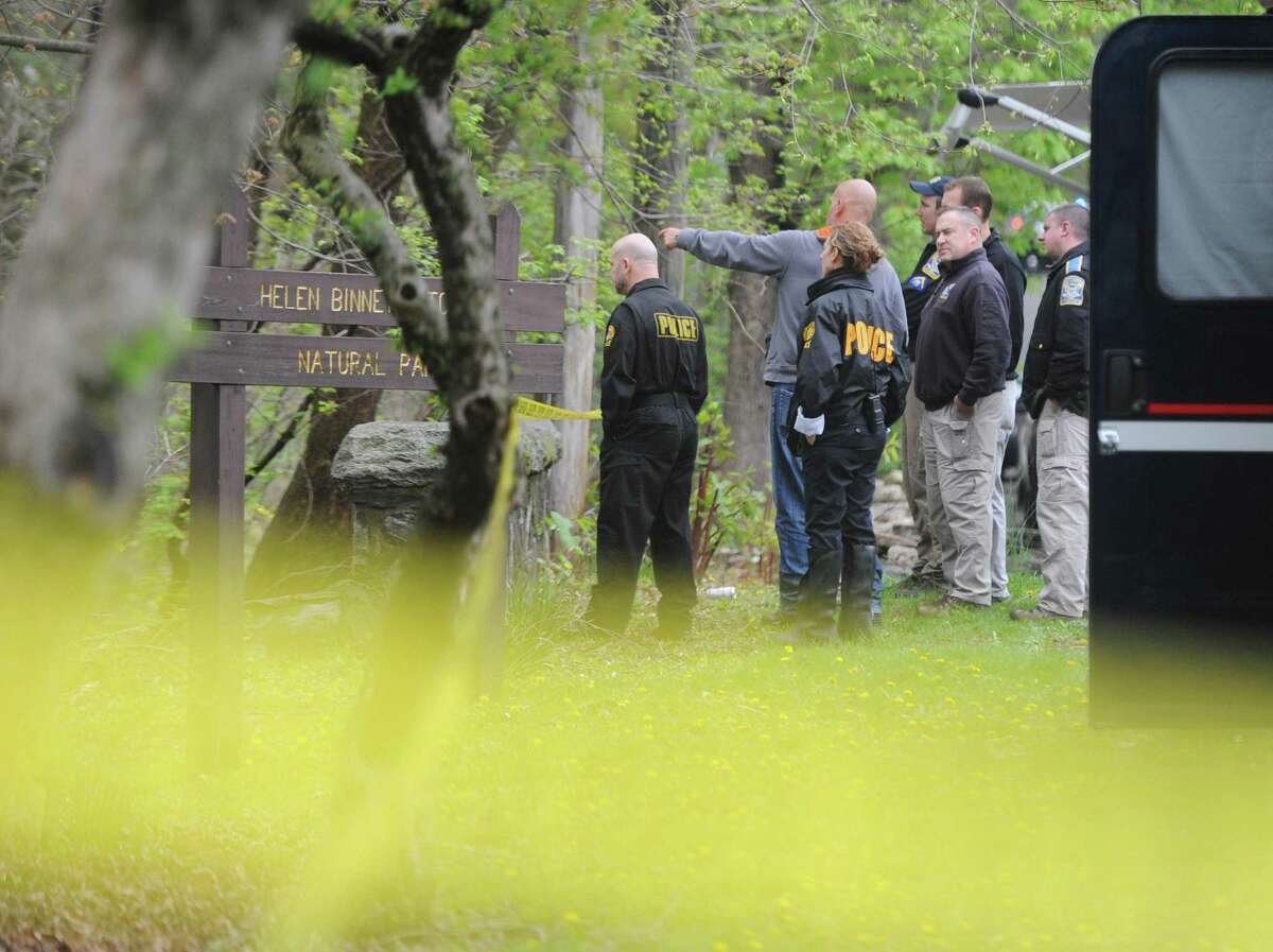 Greenwich police and state police investigate the scene in which possible human remains were found in Helen Binney Kitchel Natural Park in Old Greenwich, Conn. Wednesday, April 26, 2017. Town employees were clearing debris from the southwest section of woods when they discovered what appeared to them as being human remains.