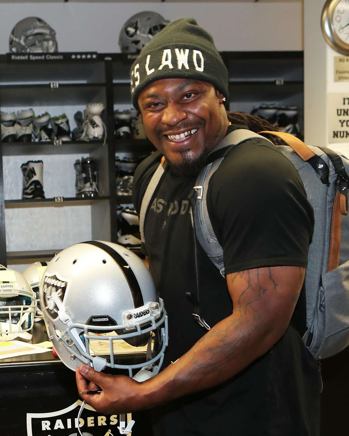 Oakland native and Cal alum Marshawn Lynch was all smiles Wednesday after agreeing to a two-year deal with the Raiders.