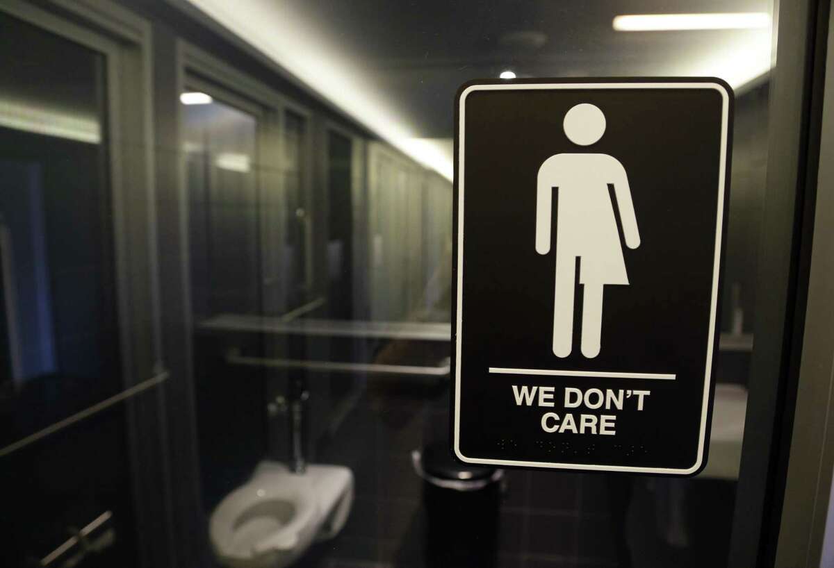 A sign outside a restroom in Durham, N.C., reflects the attitude of readers weighing in on the Texas version of bathroom legislation.