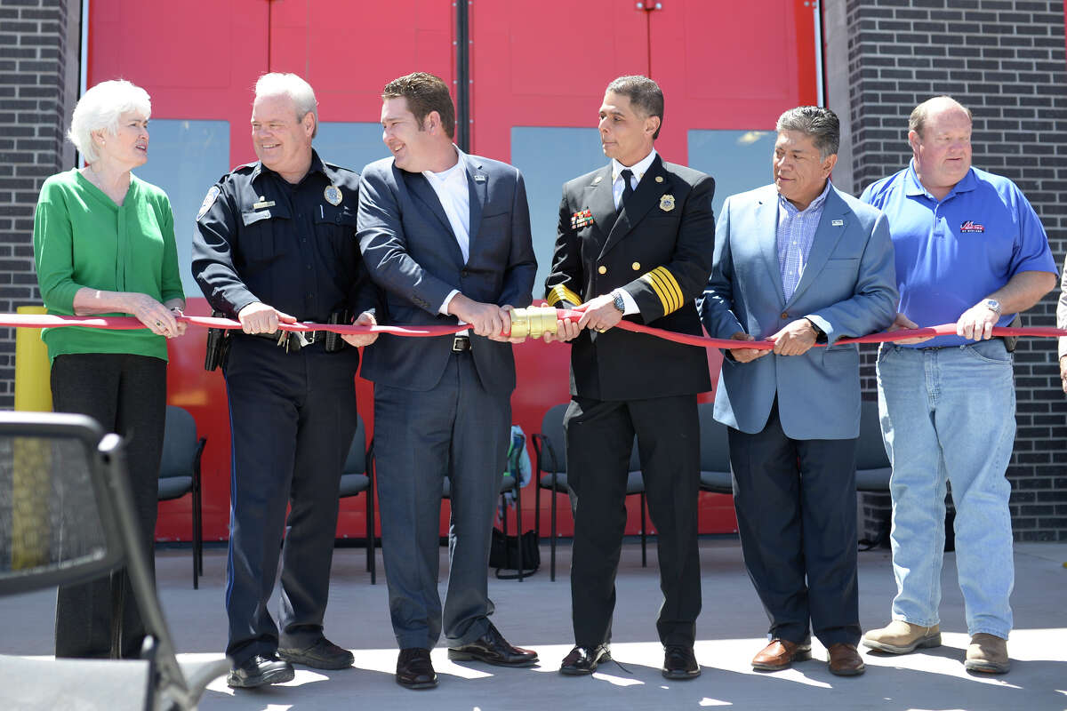City officials and building contractors opened a fire hose coupoling during the opening ceremony for Fire Station 6 on April 26, 2017. James Durbin/Reporter-Telegram