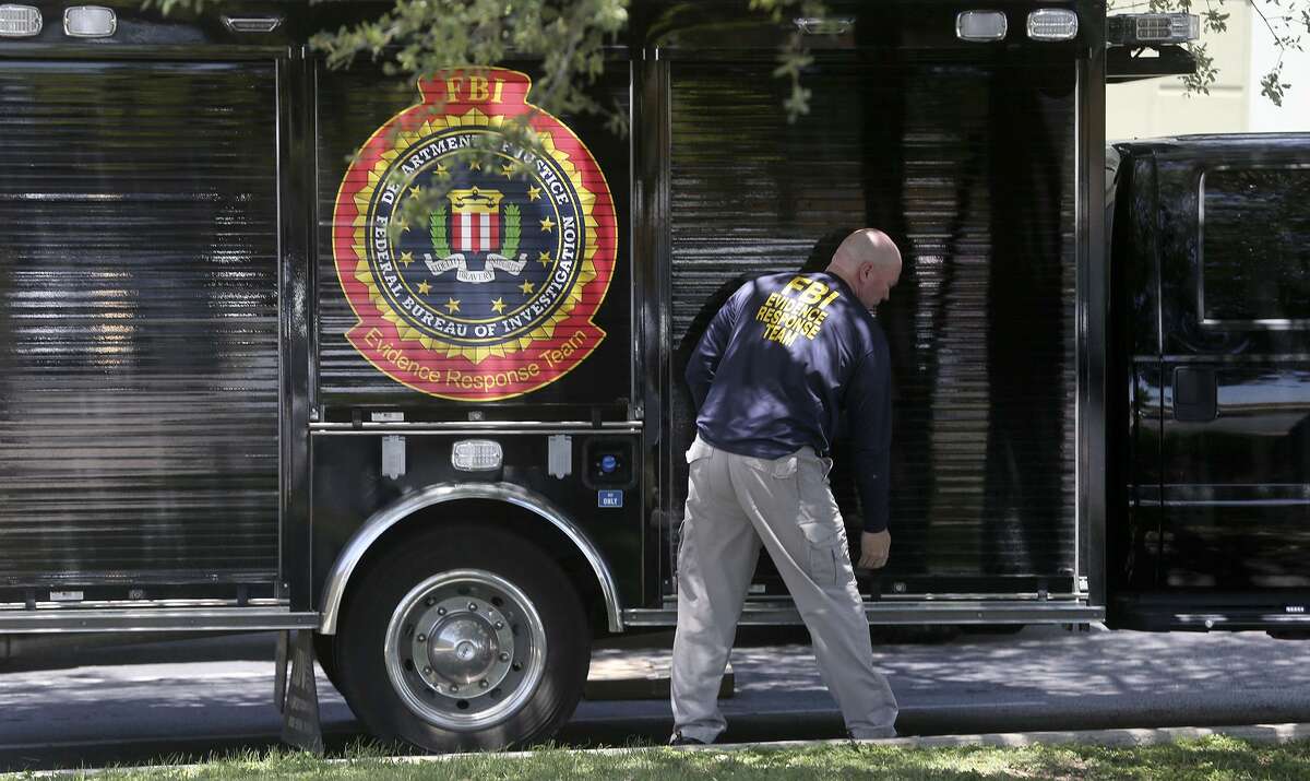 A man prepares to open an FBI truck near a Dannenbaum Engineering office. The FBI carried out raids across Texas, including at Dannenbaum offices in San Antonio and three other cities.