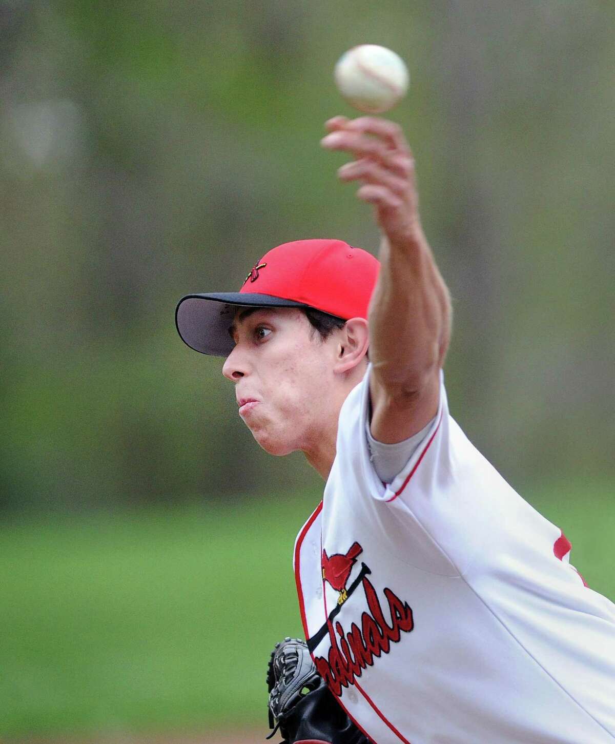Greenwich pitcher Anthony Ferraro delivers a pitch during the Cardinals’ 7-2 victory over Stamford in Greenwich. Ferraro pitched a complete game.