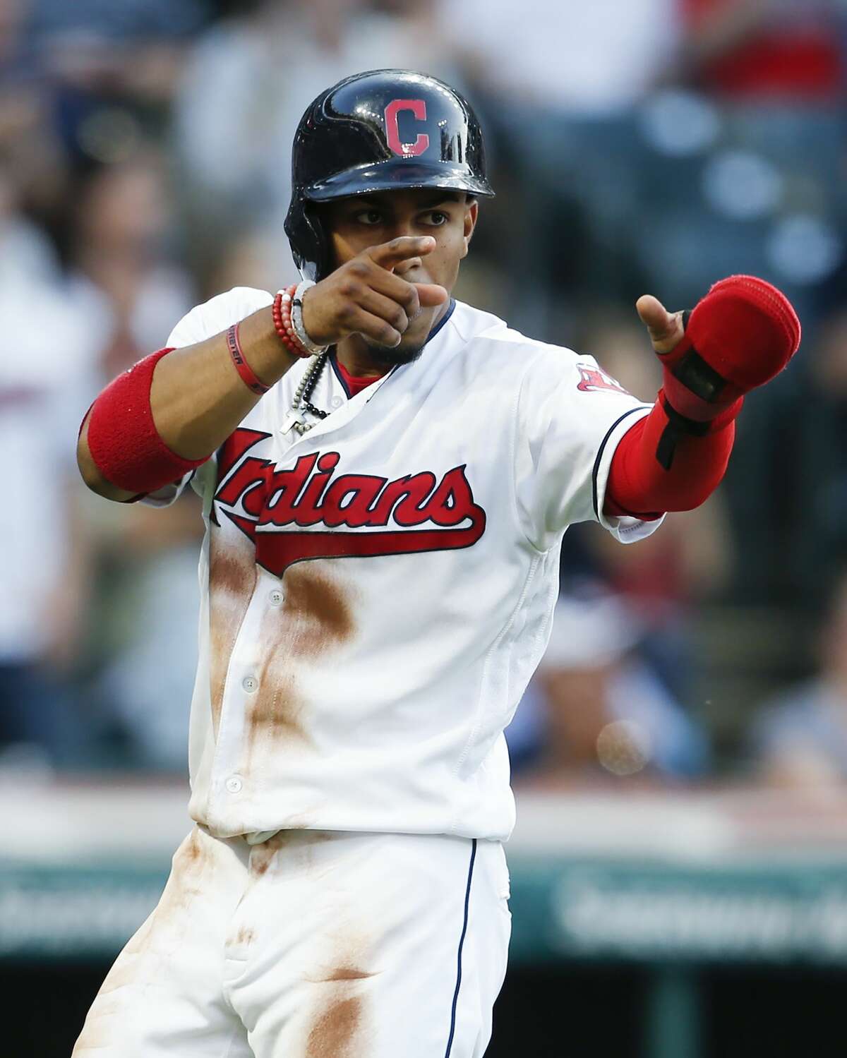 CLEVELAND, OH - APRIL 26: Francisco Lindor #12 of the Cleveland Indians points to Michael Brantley at first base after scoring on Brantley's two-run single off of pitcher Lance McCullers Jr. of the Houston Astros during the fifth inning at Progressive Field on April 26, 2017 in Cleveland, Ohio. The Indians defeated the Astros 7-6. (Photo by Ron Schwane/Getty Images)