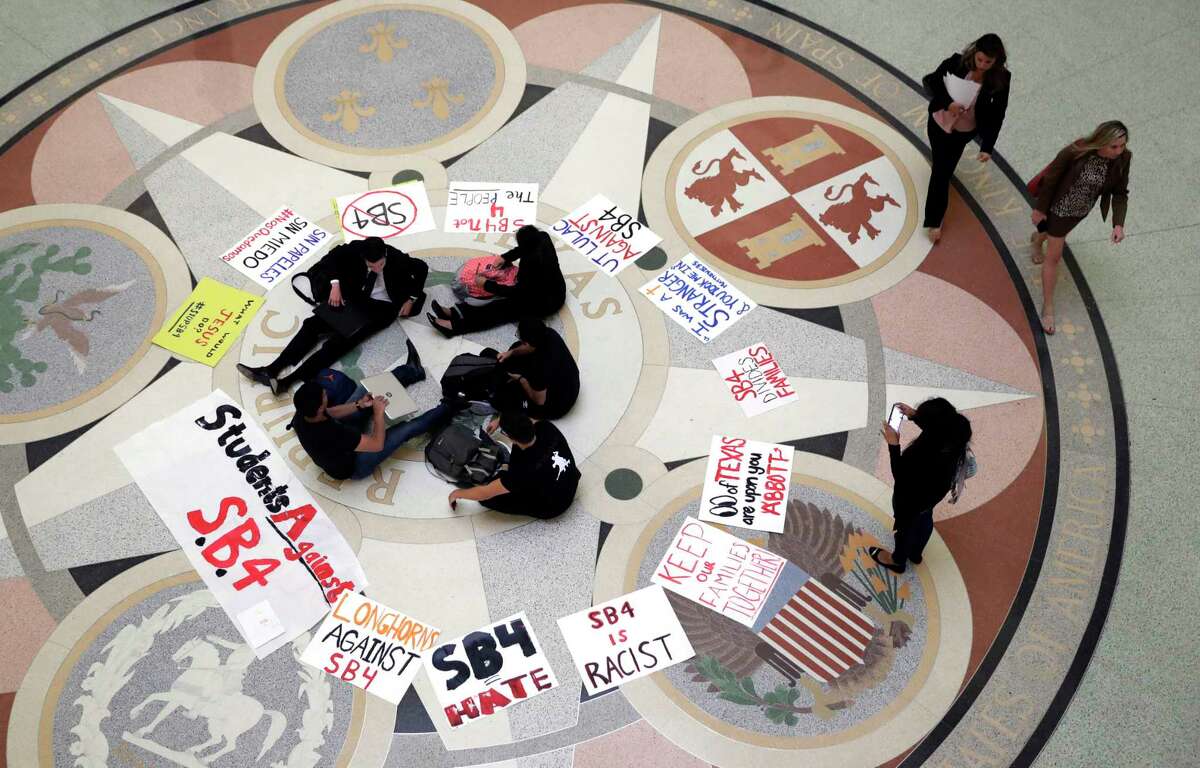 Students gather in the Rotunda at the Texas Capitol to oppose SB 4, an anti-"sanctuary cities" bill that has already cleared the Texas Senate.
