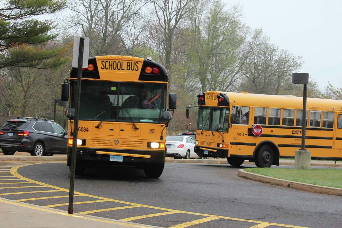 School buses at Long Lots Elementary School. Buses ran on schedule Thursday despite the bus drivers’ contract expiring on Wednesday. Negotiations are expected to continue on May 1.