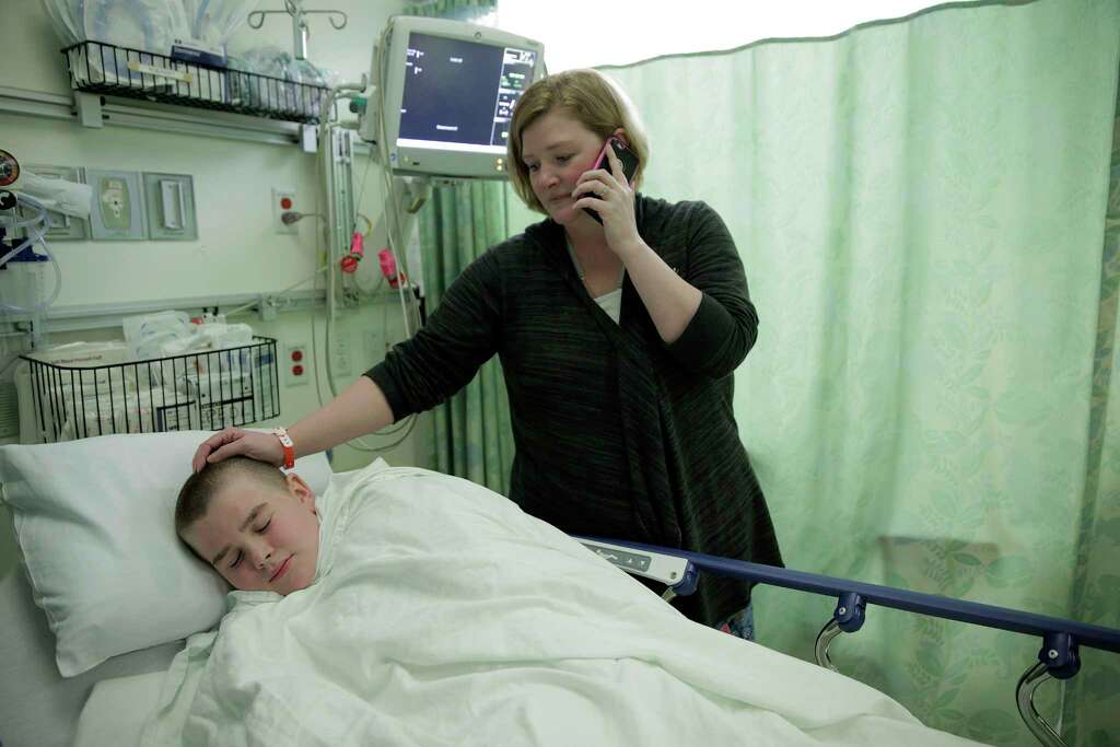 Jessica Large comforts her son, Brayden as he tries to relax before surgery at Memorial Hermann on Wednesday, April 19, 2017, in Houston.
