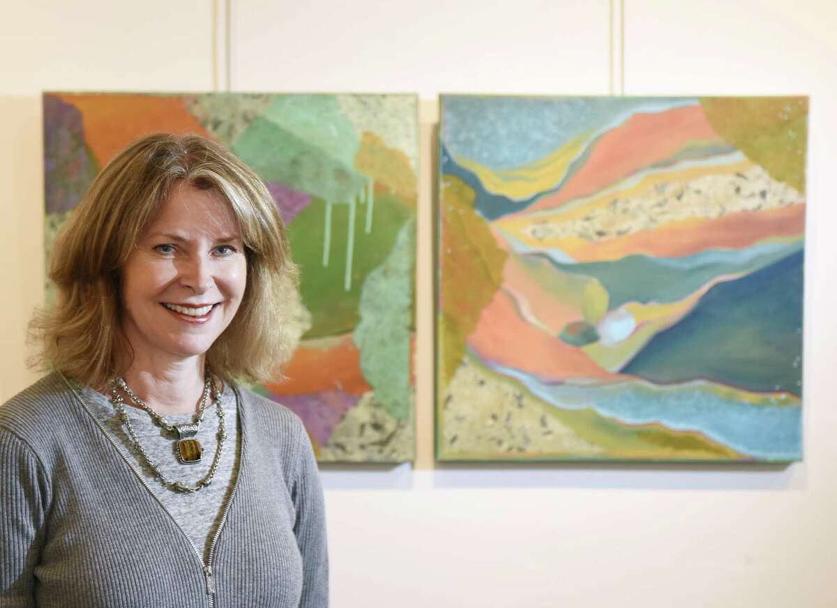Heidi Lewis Coleman poses as her first-place painting’s Tide Pool," left, and "Valyria are displayed in the 18th Annual Vivian & Stanley Reed Marine Show at the Stamford Art Association Townhouse Gallery in Stamford, Conn. Wednesday, April 26, 2017. Artists of many mediums are showing their water-themed work in the show, opening Friday, April 28 at 6 p.m.