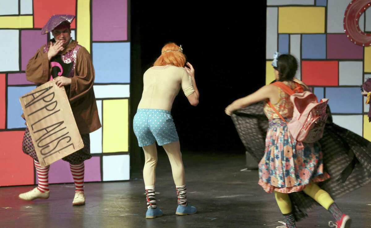 The moment when the emperor is shown to have no clothes in the Magik Theater's production of "The Emperor's New Threads" is seen April 26, 2017. Though the emperor is supposed to be "naked" he actually wears a comical buy suit and boxer shorts.