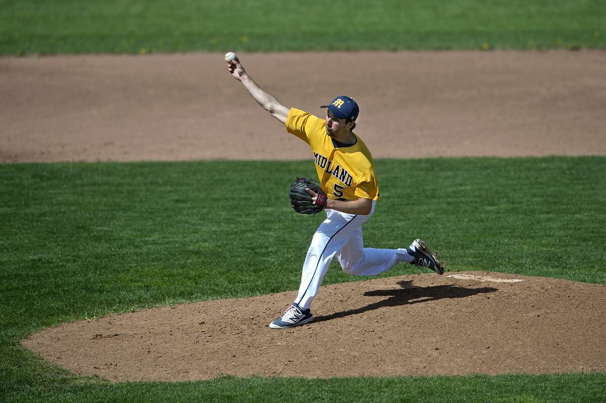 Midland High's Chance Freed pitches to a Flint Powers batter in the second inning of the Thursday afternoon game.