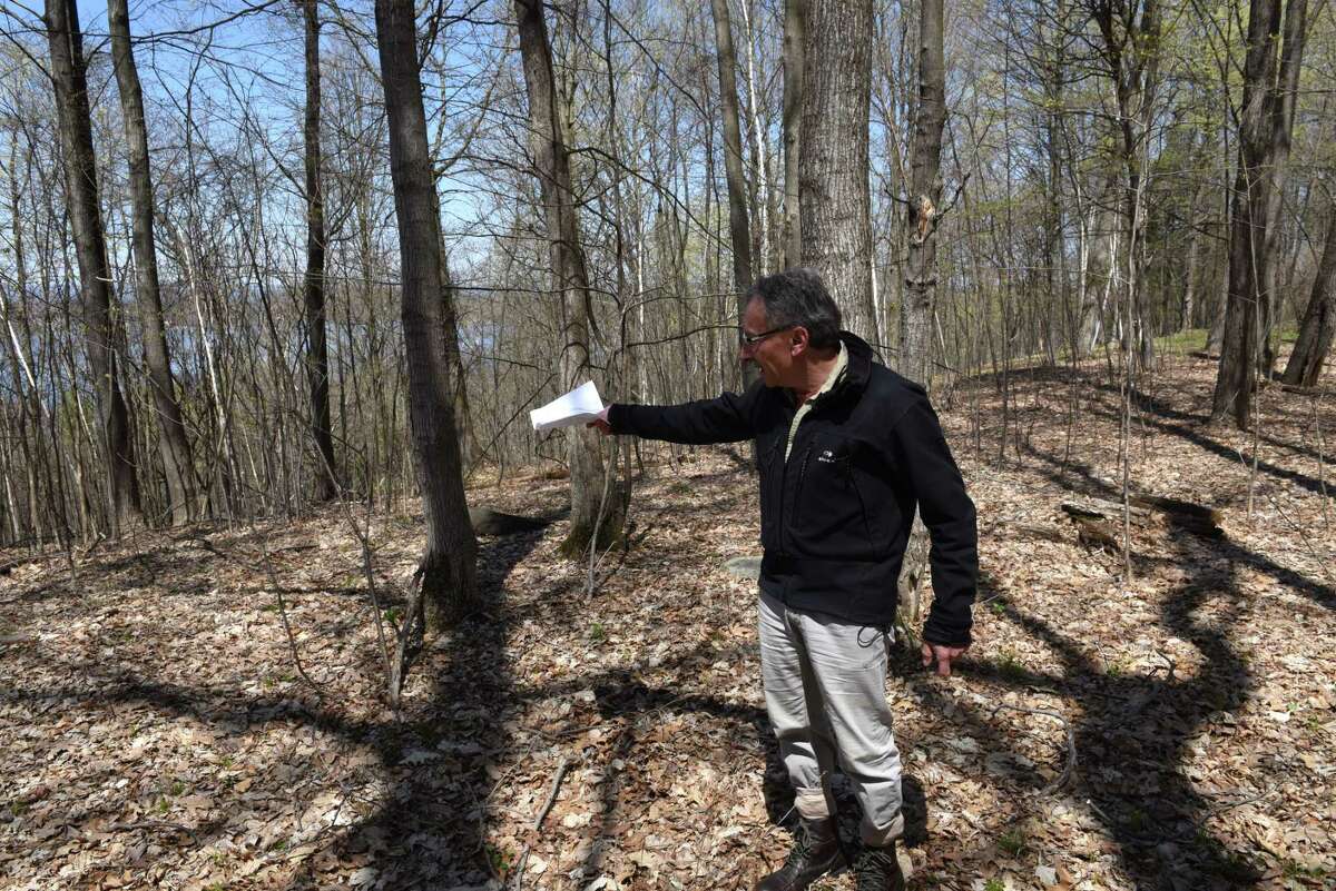 Dr. Tom Yannios stands at the edge of his property where a proposed development is planned on Hill Road on Monday, April 24, 2017, in Stillwater, N.Y. Neighbors are upset with developer John Witt?’s plans to clear cut trees from the property. They believe that it would create an ecological disaster for the lake and water table. (Will Waldron/Times Union)