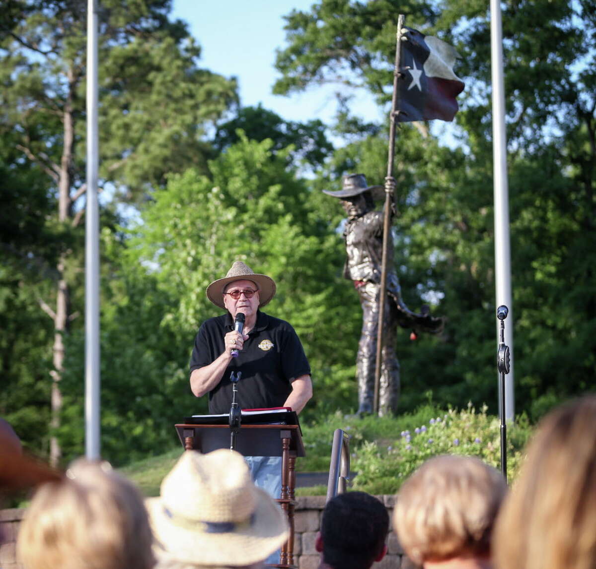 Poet Dave Parsons reads The Texian during the annual flag raising ceremony on Friday, April 21, 2017, at Lone Star Monument and Historical Flag Park.