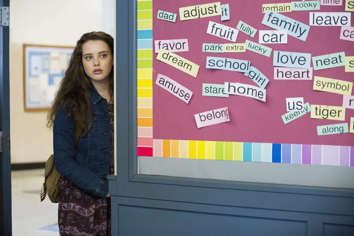 This image released by Netflix shows Katherine Langford in a scene from the series, "13 Reasons Why," about a teenager who commits suicide. The stomach-turning suicide scene has triggered criticism from some mental health advocates that it romanticizes suicide and even promoted many schools across the country to send warning letters to parents and guardians. The show’s creators are unapologetic, saying their frank depiction of teen life needs to be “unflinching and raw.” (Beth Dubber/Netflix via AP)