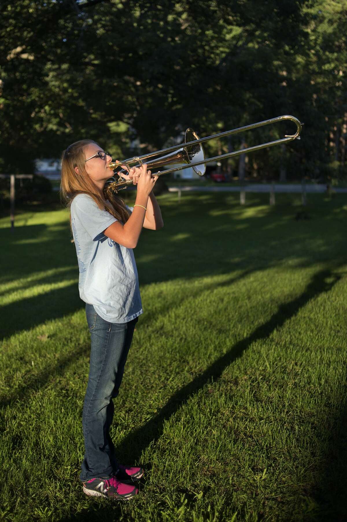 BRITTNEY LOHMILLER | blohmiller@mdn.net Meridian High School freshman Cassidy Forbes practices her trombone in her backyard September 2, 2016 in Sanford. "The band program is what made me want to stay at Meridian," Cassidy said. "We're no know for our sports but our band is good."