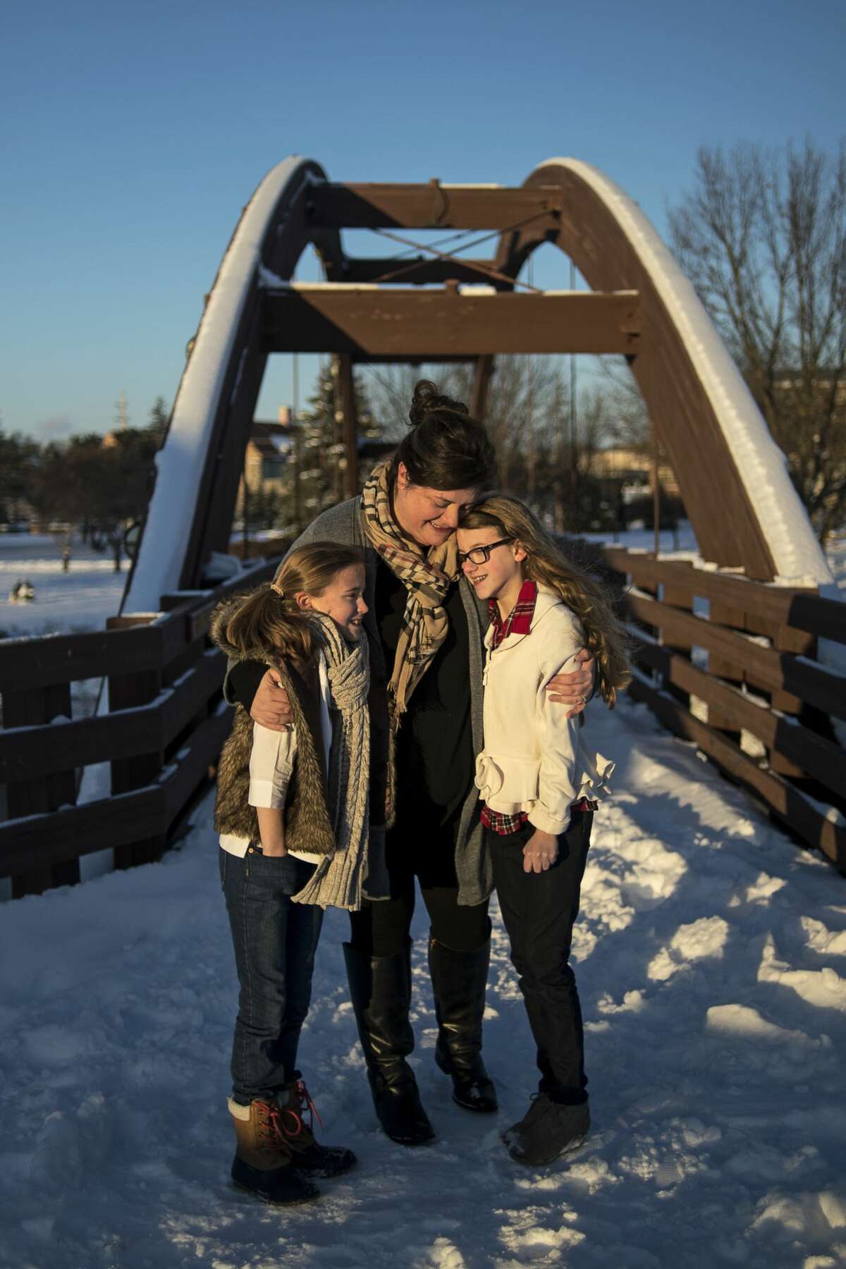 ERIN KIRKLAND | ekirkland@mdn.net Happy.pretty owner Melanie Marshall poses for a portrait on the Tridge with her daughters Chloe Marshall, 11, left, and Annabelle Marshall, 12, right.