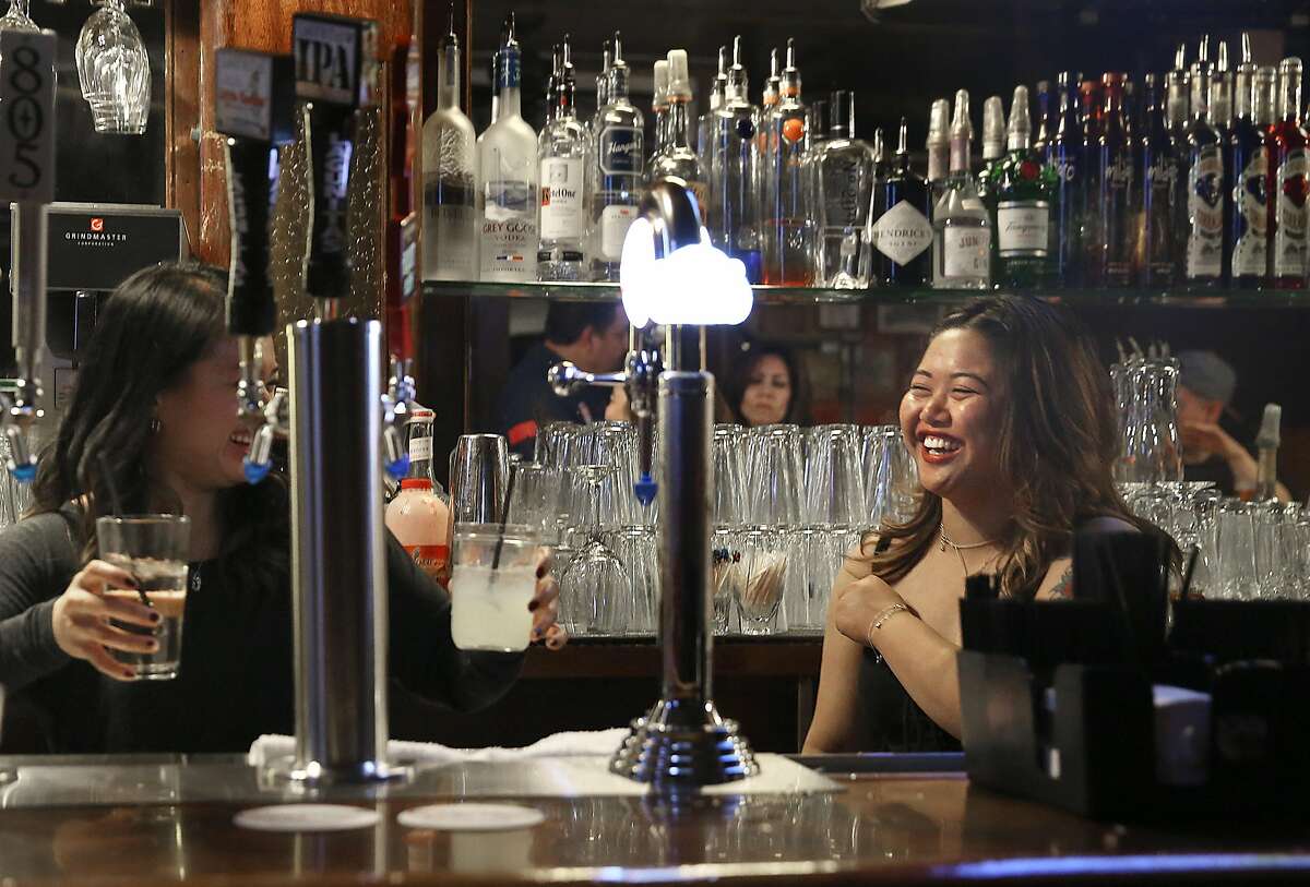 Bartender May May Wise (right) works at 7 miles house, a sports bar founded in 1853, on Wednesday, April 28, 2017, in San Francisco, Calif.