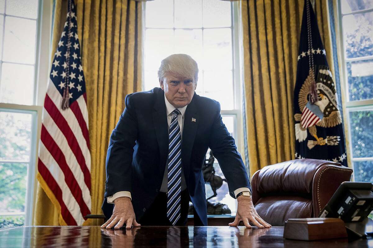 President Donald Trump poses for a portrait in the Oval Office in Washington, Friday, April 21, 2017. With his tweets and his bravado, Trump is putting his mark on the presidency in his first 100 days in office. He's flouted conventions of the institution by holding on to his business, hiring family members as advisers and refusing to release his tax returns. He's tested conventional political wisdom by eschewing travel, church, transparency, discipline, consistency and decorum. But the presidency is also having an impact on Trump, prompting him, at times, to play the role of traditional president. (AP Photo/Andrew Harnik)