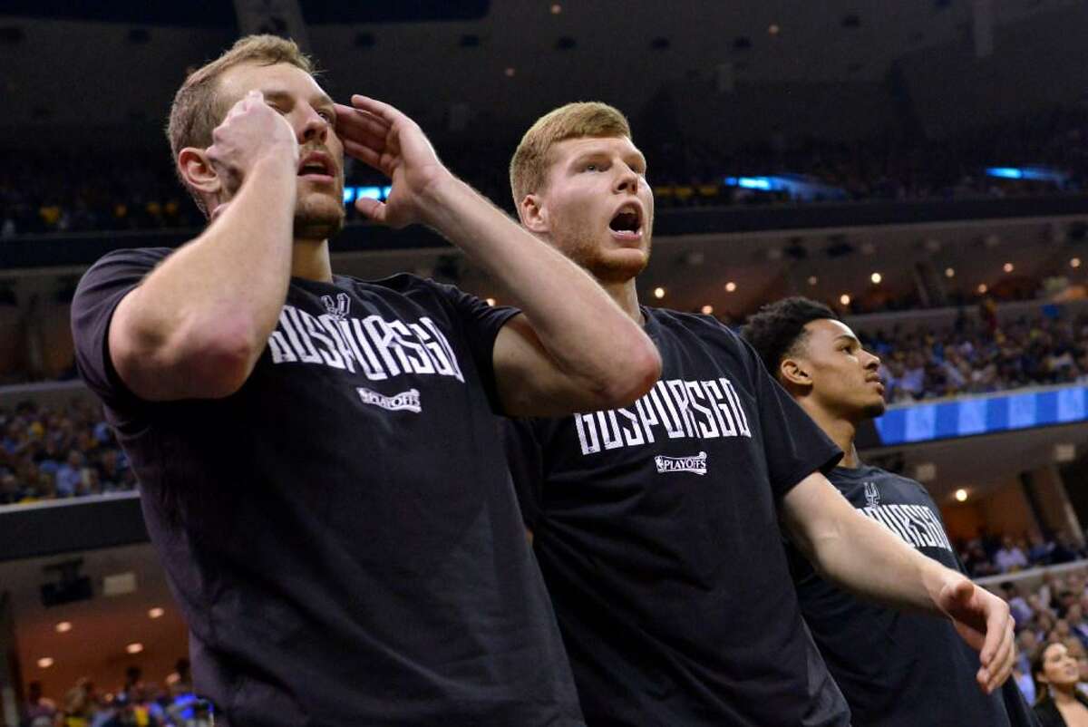 San Antonio Spurs forward David Lee, from left, forward Davis Bertans, and guard Dejounte Murray react from the sideline during the second half of Game 6 in an NBA basketball first-round playoff series against the Memphis Grizzlies Thursday, April 27, 2017, in Memphis, Tenn.
