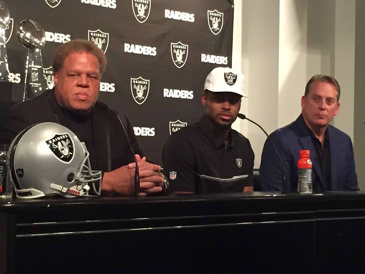 Raiders GM Reggie Mckenzie (left) and Raiders Coach Jack Del Rio (right) with the Raiders first round selection of the NFL Draft, Gareon Conley on Friday April 28, 2017 at Oakland Alameda Coliseum in Oakland, Calif.