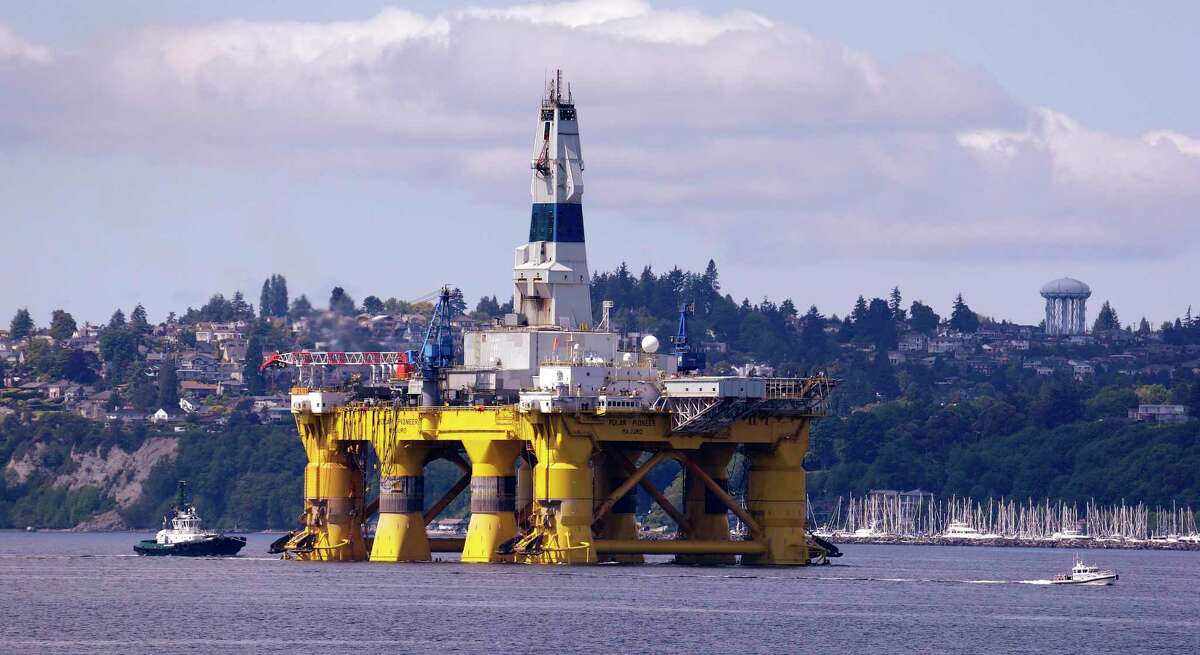 FILE - In this May 14, 2015 file photo, the oil drilling rig Polar Pioneer is towed toward a dock in Elliott Bay in Seattle. Working to dismantle his predecessor's environmental legacy, President Donald Trump signed an executive order on Friday, April 28, 2017, aimed at expanding drilling in the Arctic and opening other federal areas to oil and gas exploration. (AP Photo/Elaine Thompson, File)