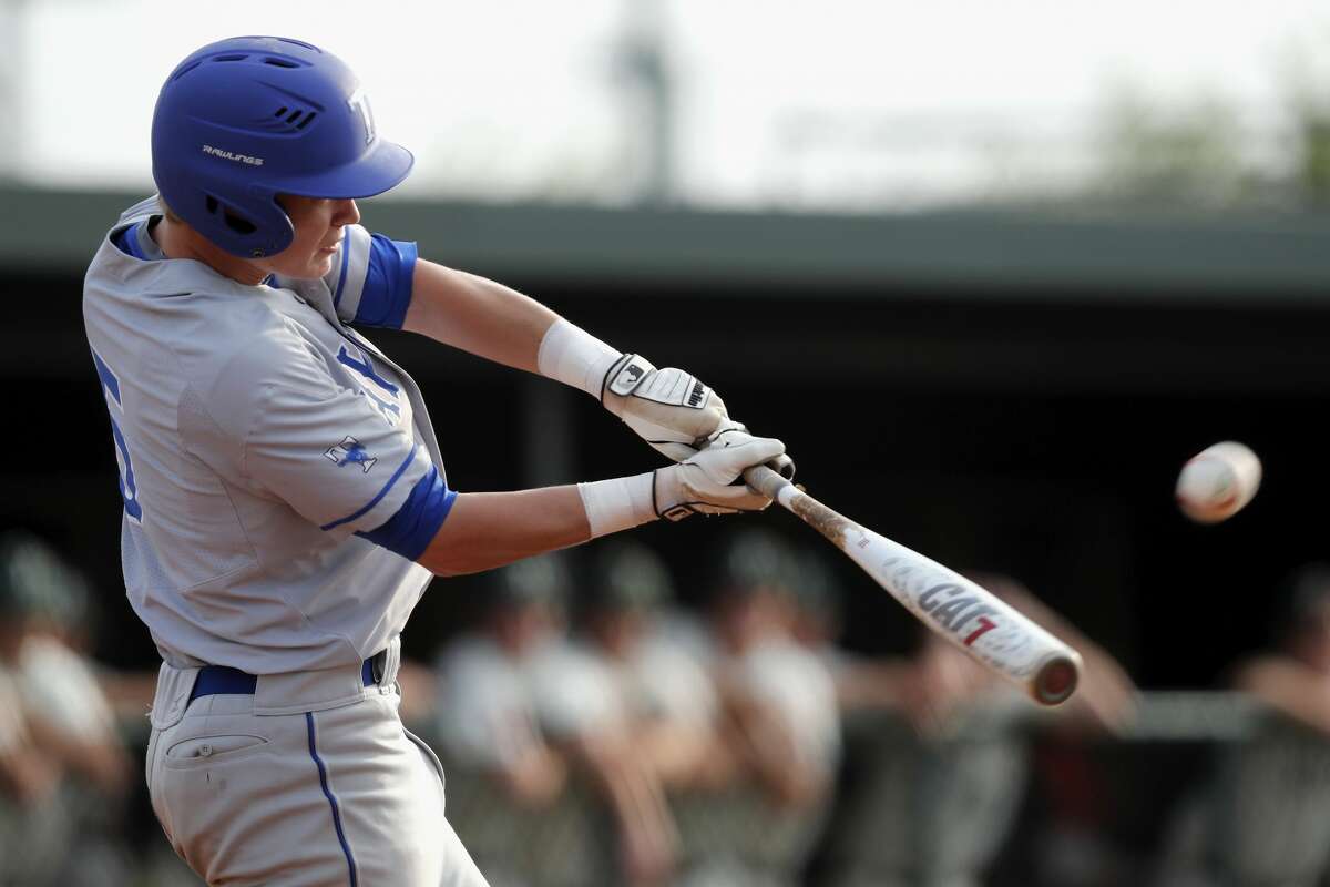 Taylor Mustangs left fielder Matt Stockard (5) bats during the high school baseball game between the Katy Taylor Mustangs and the Strake Jesuit Crusaders at Markle Steel Field at Strake Jesuit High School on Friday, April 28, 2017 in Houston, TX.