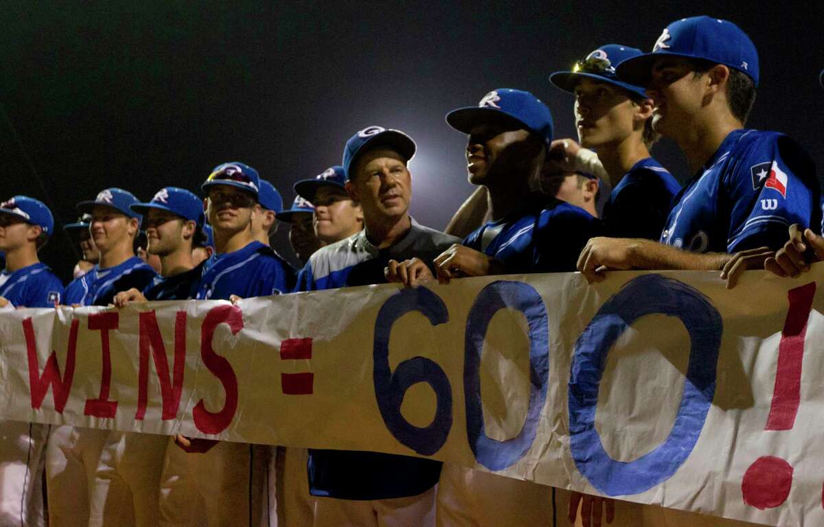 Oak Ridge head coach Mike Pirtle, center, is seen after the War Eagles defeated Montgomery 8-0 for Pirtle's 600th career win, Friday, April 28, 2017, in Oak Ridge.
