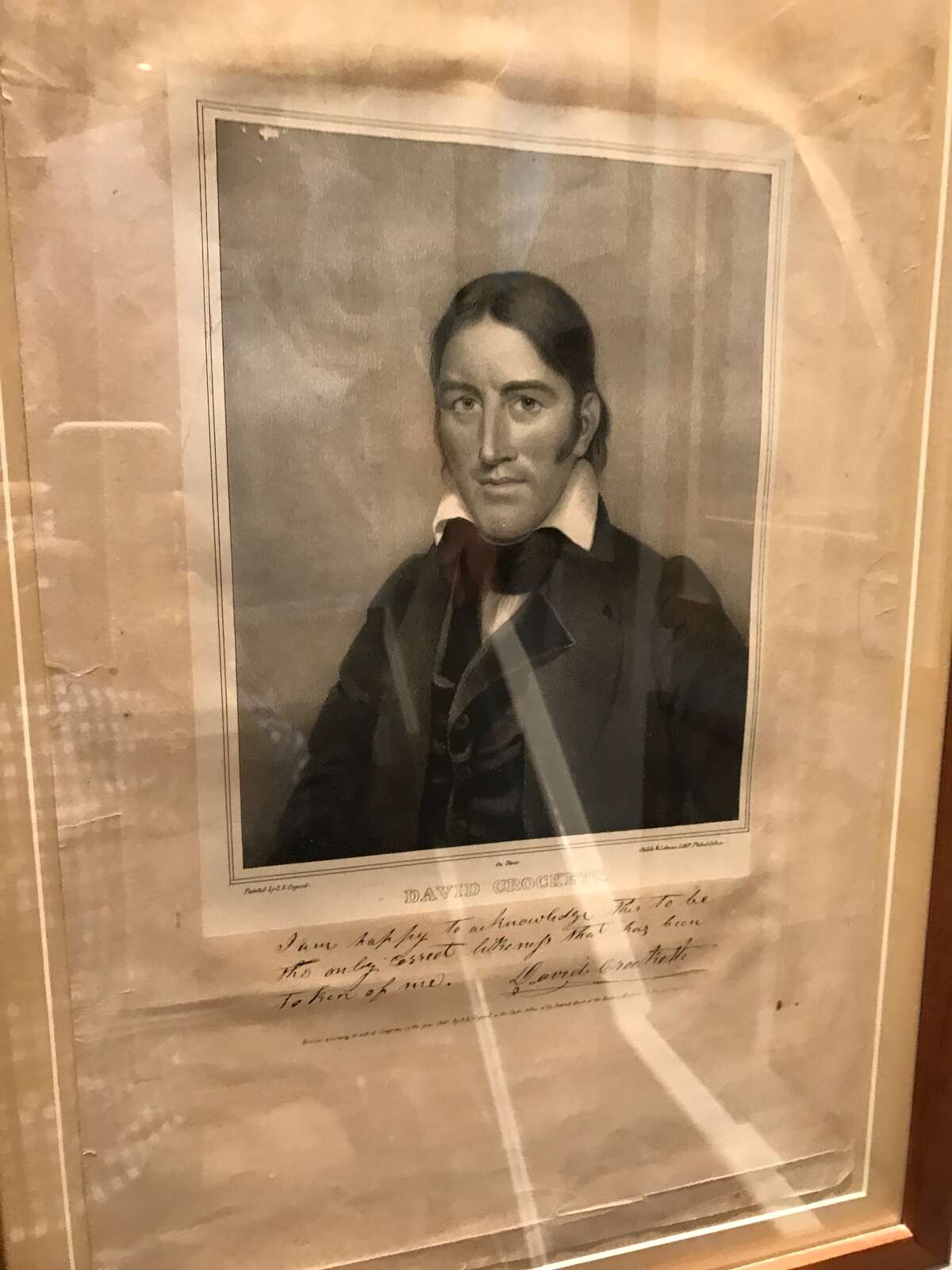 The caption reads: "I am happy to acknowledge this to be the only correct lithograph that has been taken of me." Signed, David Crockett
