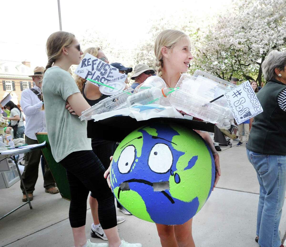 Milli Getz, 13, of Greenwich, wore a distressed Earth costume that she made during the Children's Environmental March at Greenwich Town Hall, Greenwich, Conn., Saturday morning, April 29, 2017. The gathering of the young environmentalists and their families coincided with the People's Climate March that was taking place in Washington, D.C.