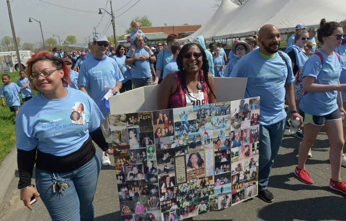 Alicia Bobb nad Celeste Weekes walk for cancer victim Myan Williams as over 2,000 participants gather at Calf Pasture Beach Saturday, April 29, 2017, for the 14th annual Whittingham Cancer Center Walk & Sally?’s Run in Norwalk, Conn.